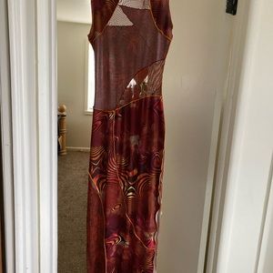 Beautiful, body hugging dress with transparent sections.  Ankle Length.